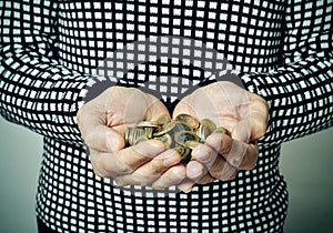 Young man with euro coins in his hands