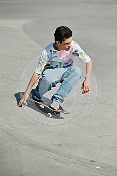 A young man executes tricks atop