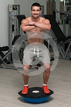 Young Man Exercising - Bosu Balance Ball