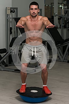 Young Man Exercising - Bosu Balance Ball