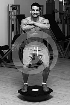 Young Man Exercising - Bosu Balance Ball