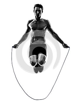 Young man exercising jumping rope silhouette