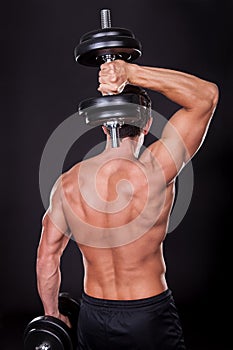 Young Man Exercising With Weightlift