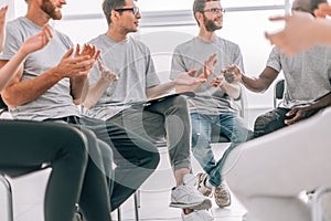 Young man explaining something to his associates