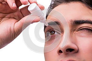 The young man in eye care medical concept