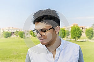 Young man with eye wear in garden.