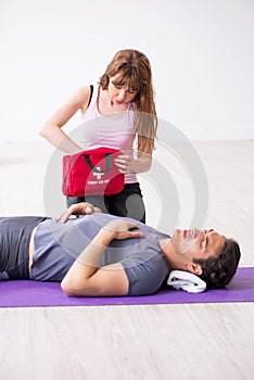 Young man feeling bad during training in first aid concept