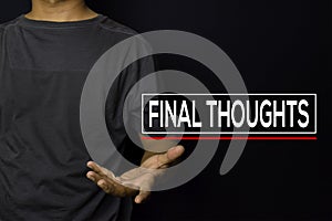 Young man with Final Thoughts text isolated on black background photo