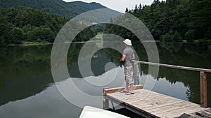 Young man fishing from a dock