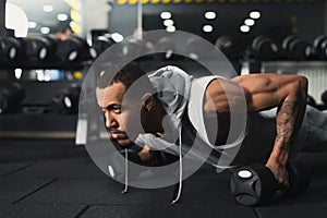 Young man fitness workout, push ups or plank