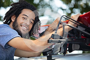 young man fitting roof rack car