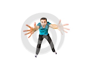 Young man flies in widely separated hands isolated on white. Concept fitness or trampoline center