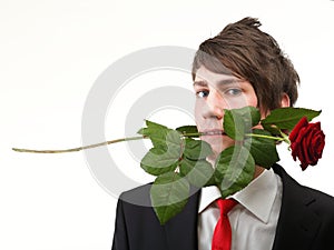 Young man, flower, red rose isolated