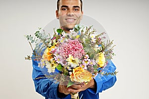 Young man with flowers