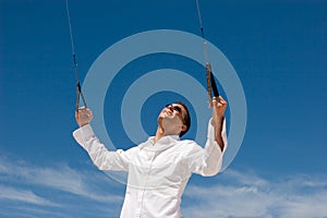 Young Man Flying a Stunt Kite