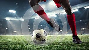Young man football player kicking ball during match at stadium. Flyer for ad, design.