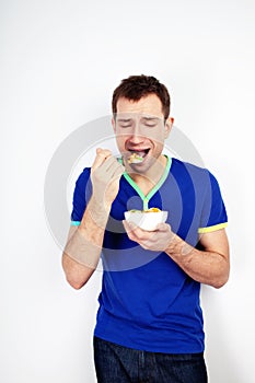 Young man forced to eat yogurt