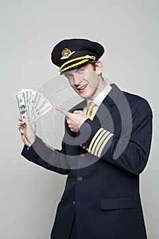 Young man in the form of a passenger plane pilot