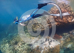 Young man freediver swim underwater, Freediving in tropical ocean at phuket islands