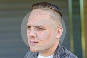 Young man frowning in consternation