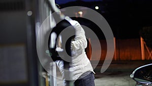 Young man fueling his car at gas station