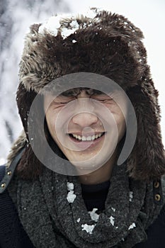 Young Man in Fur Hat with Eyes Closed, Snowball fight