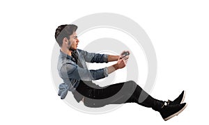 Young man with game controller plays with a video game