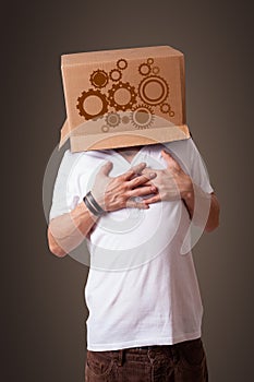 Young man gesturing with a cardboard box