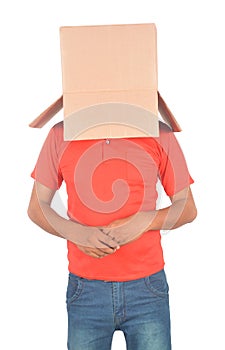 Young man gesturing with a cardboard box on his head isolated on