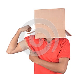 Young man gesturing with a cardboard box on his head isolated on