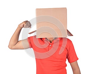 Young man gesturing with a cardboard box on his head isolated on