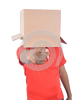 Young man gesturing with a cardboard box on his head isolated on
