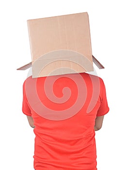 Young man gesturing with a cardboard box on his head isolated on