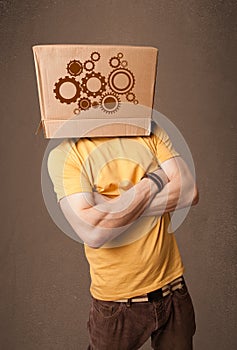 Young man gesturing with a cardboard box on his head with spur w