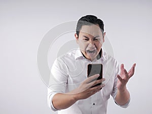 Young Man Getting Bad News on Phone, Shocked and Angry