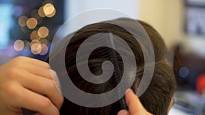 Young man getting haircut