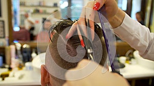 Young man getting haircut