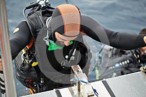 Young man getting ready for scuba diving