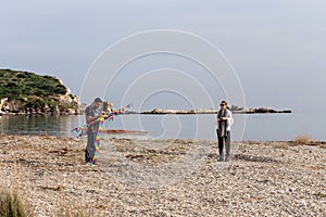 Young man and girl with a airy kite