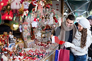 Young man with girlfriend at X-mas market