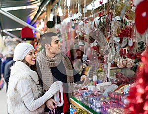 Young man with girlfriend at X-mas market