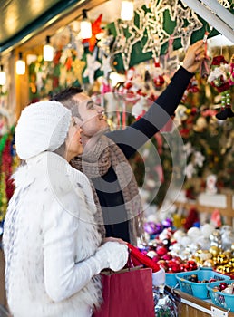 Young man with girlfriend at X-mas market