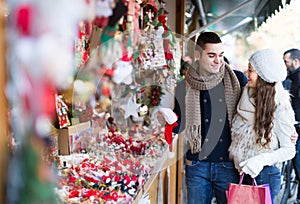 Young man with girlfriend at X-mas market