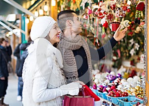 Young man with girlfriend at X-mas market