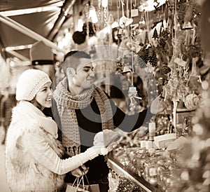 Young man with girlfriend at X-mas market