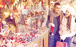 Young man with girlfriend at X-mas market