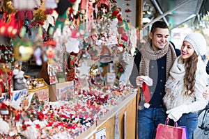 Young man with girlfriend at X-mas market