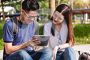 Young Man and girls friend classmates sitting consult