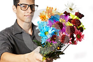 Young man giving flowers