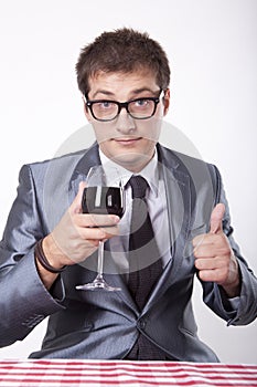 Young man with a glass of wine
